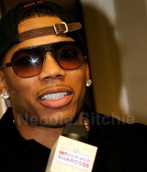 nelly fake teeth