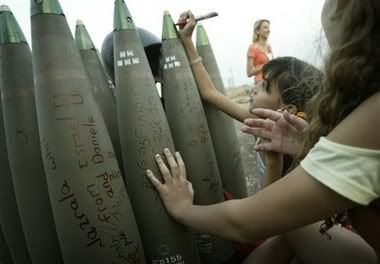 Israeli girls write messages on shells