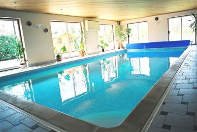 Long Indoor Swimming Pool Wood Ceiling Beams Royalty Free Stock