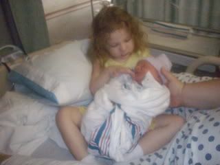 Sara holding Matthew for the first time