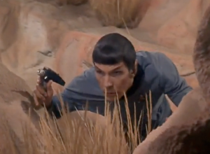 Spock crouching in the grass